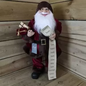 Premier Decorations Ltd - 60cm Standing Santa with Glasses Holding List and Parcels In Burgundy