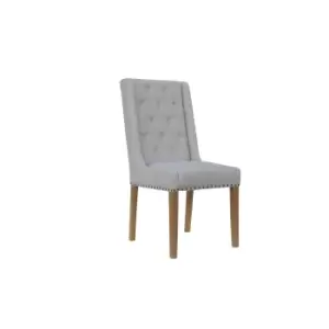 Kettle Interiors Button Back Upholstered Chair With Side Supports And Nailhead Trim Natural